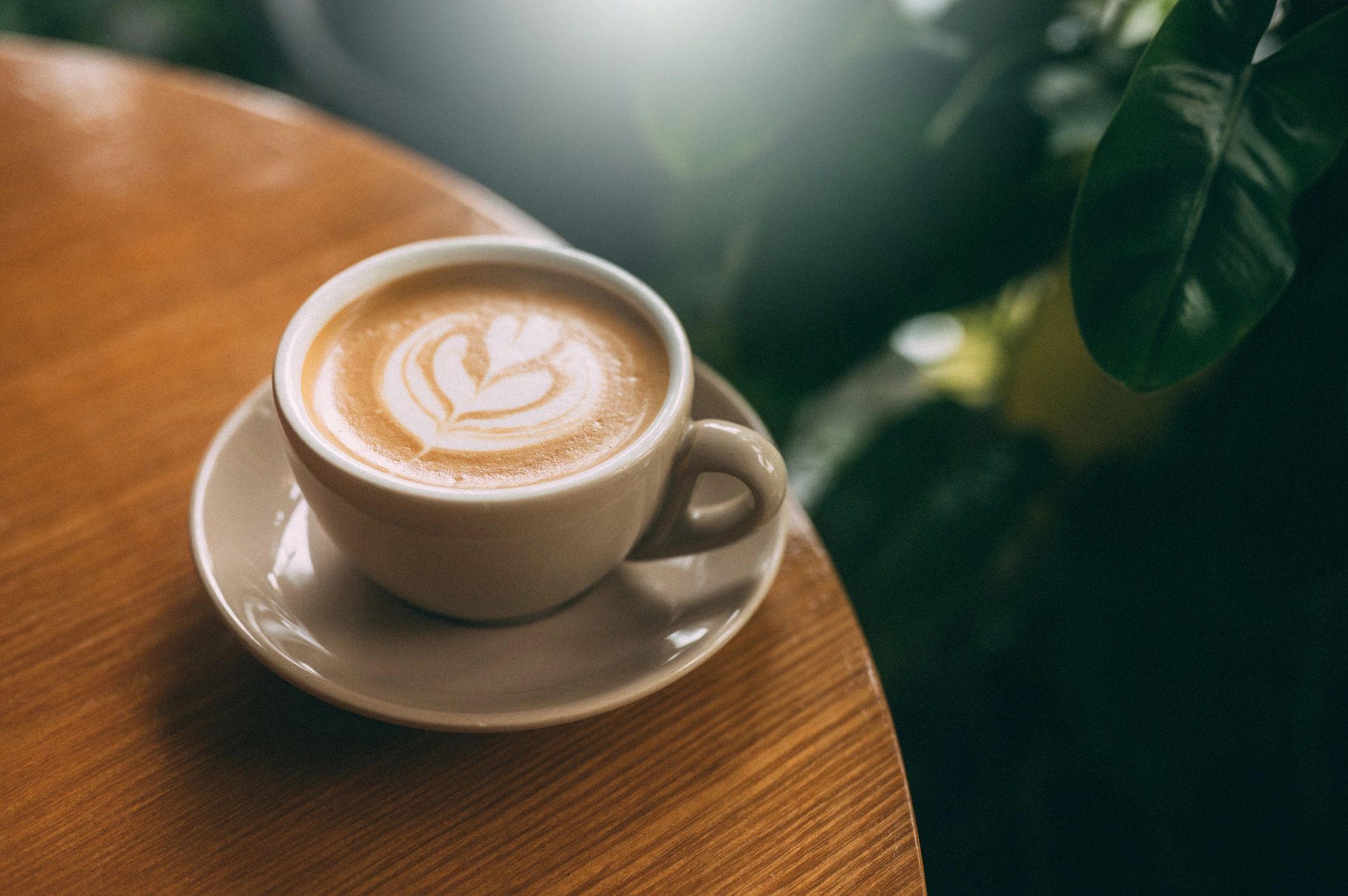 Latte art coffee on a wooden table