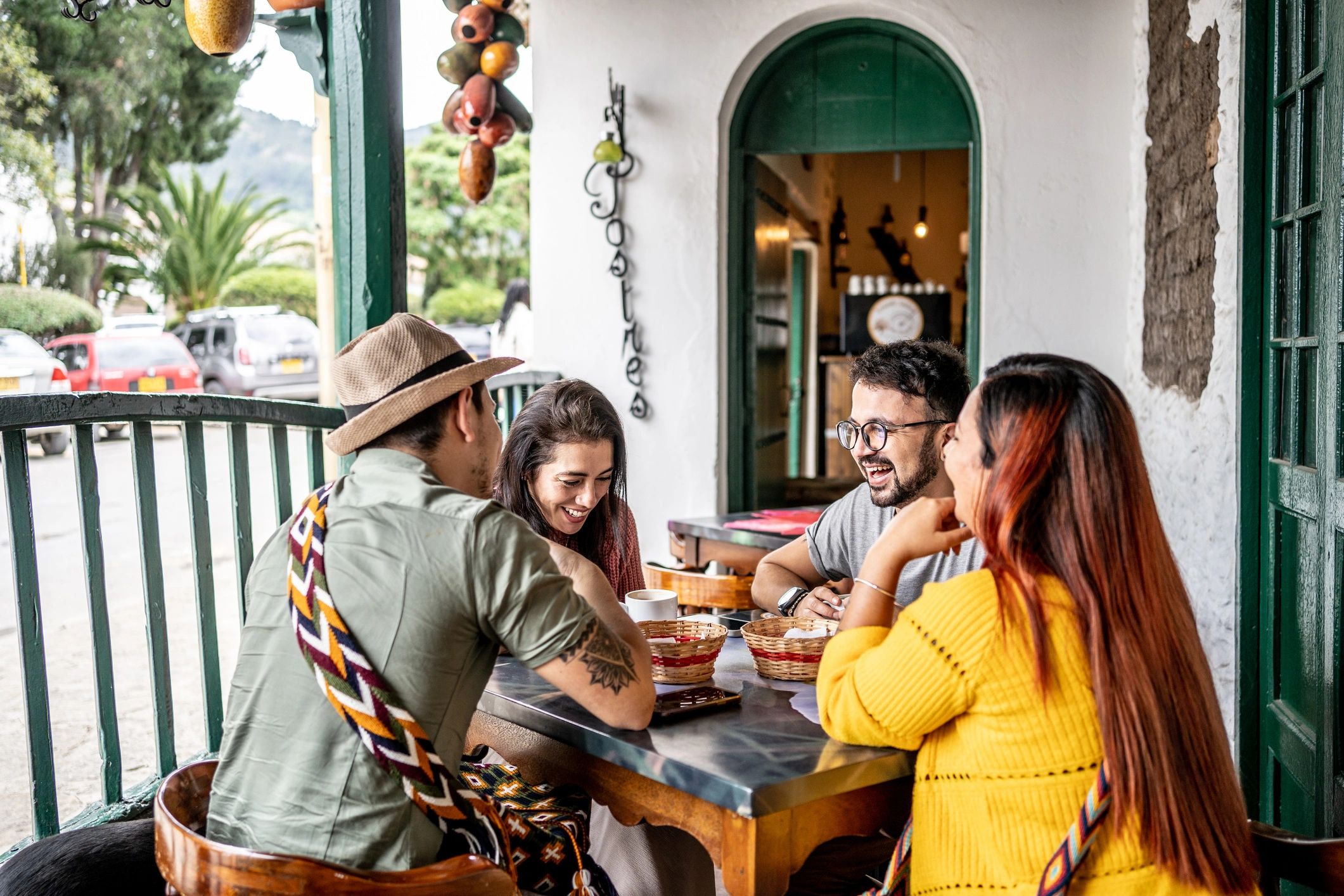 Friends chatting at a coffee shop table