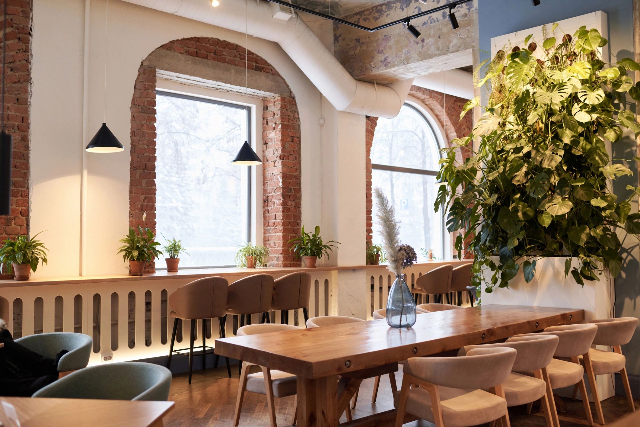 Modern cafe interior with tables and warm lighting